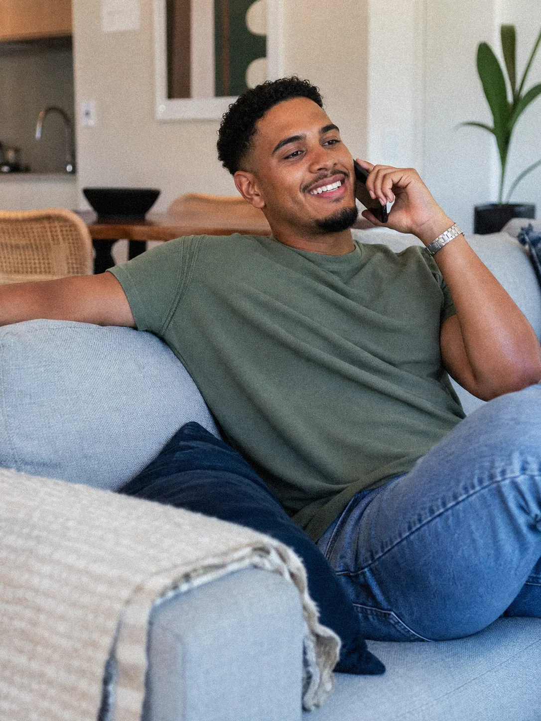 A patient at home on a phone call for an online psychiatry consultation